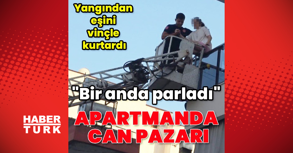 Yangında eşini vinçle kurtardı